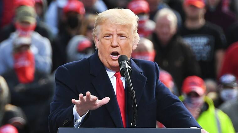 US President Donald Trump speaks during a campaign rally at Manchester-Boston Regional Airport in Londonderry, New Hampshire on October 25, 2020. - Donald Trump's reelection campaign on Sunday sought to brush off another Covid outbreak in his team by focusing its attacks on Joe Biden's energy levels and accusing him of "47 years of failure" in Washington. Nine days before the vote, the US has been engulfed by a surge in Covid-19 cases, reaching a record number of daily infections for a second day running on Saturday with nearly 89,000 new cases. (Photo by MANDEL NGAN / AFP) (Photo by MANDEL NGAN/AFP via Getty Images)