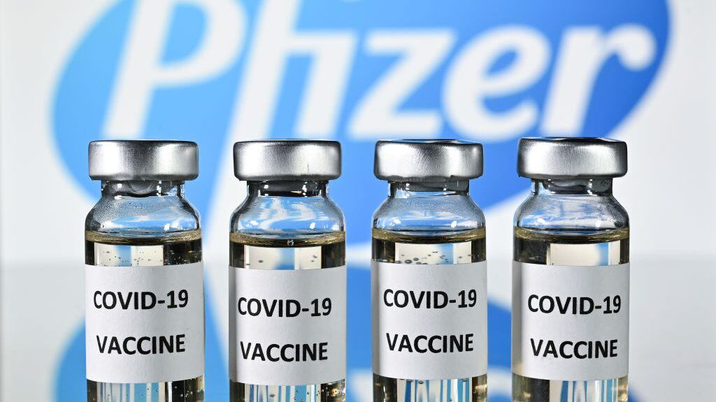 An illustration picture shows vials with Covid-19 Vaccine stickers attached, with the logo of US pharmaceutical company Pfizer, on November 17, 2020. (Photo by JUSTIN TALLIS / AFP) (Photo by JUSTIN TALLIS/AFP via Getty Images)