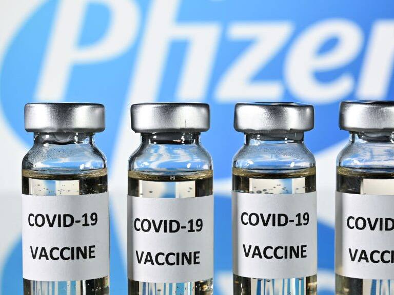 An illustration picture shows vials with Covid-19 Vaccine stickers attached, with the logo of US pharmaceutical company Pfizer, on November 17, 2020. (Photo by JUSTIN TALLIS / AFP) (Photo by JUSTIN TALLIS/AFP via Getty Images)