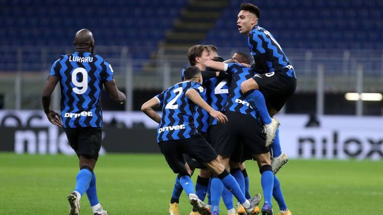MILAN, ITALY - JANUARY 26: (BILD ZEITUNG OUT) Christian Eriksen of FC Internazionale celebrates after scoring his team's second goal with team mates during the Coppa Italia match between FC Internazionale and AC Milan at Stadio Giuseppe Meazza on January 26, 2021 in Milan, Italy. Sporting stadiums around Italy remain under strict restrictions due to the Coronavirus Pandemic as Government social distancing laws prohibit fans inside venues resulting in games being played behind closed doors. (Photo by Sportinfoto/DeFodi Images via Getty Images)
