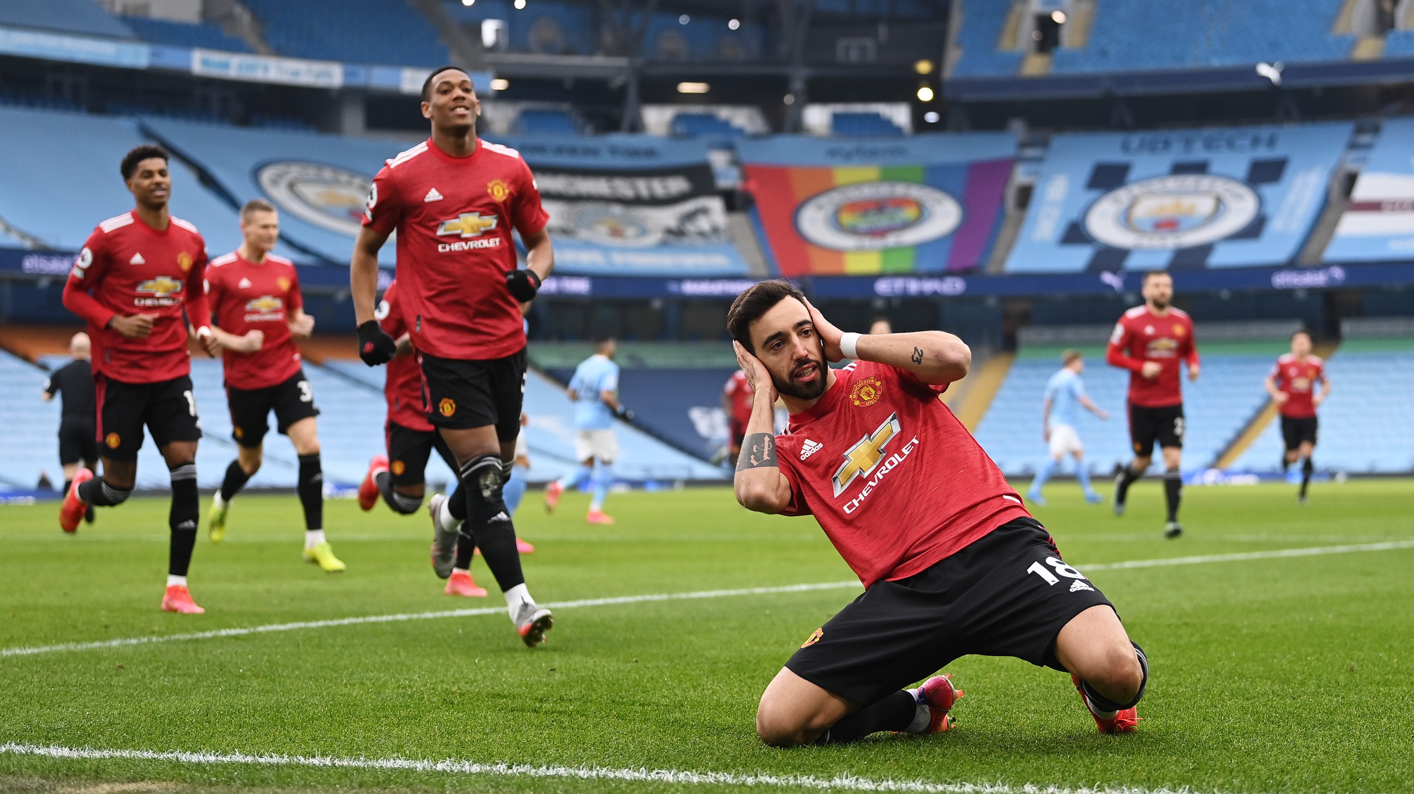 MANCHESTER, ENGLAND - MARCH 07: Bruno Fernandes of Manchester United celebrates after scoring their side's first goal from the penalty spot during the Premier League match between Manchester City and Manchester United at Etihad Stadium on March 07, 2021 in Manchester, England. Sporting stadiums around the UK remain under strict restrictions due to the Coronavirus Pandemic as Government social distancing laws prohibit fans inside venues resulting in games being played behind closed doors. (Photo by Laurence Griffiths/Getty Images)