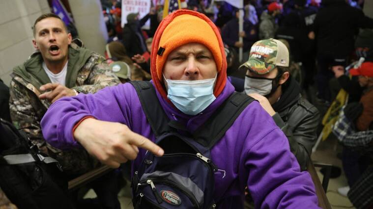 WASHINGTON, DC - JANUARY 06: Protesters enter the U.S. Capitol Building on January 06, 2021 in Washington, DC. Congress held a joint session today to ratify President-elect Joe Biden's 306-232 Electoral College win over President Donald Trump. A group of Republican senators said they would reject the Electoral College votes of several states unless Congress appointed a commission to audit the election results. (Photo by Win McNamee/Getty Images)