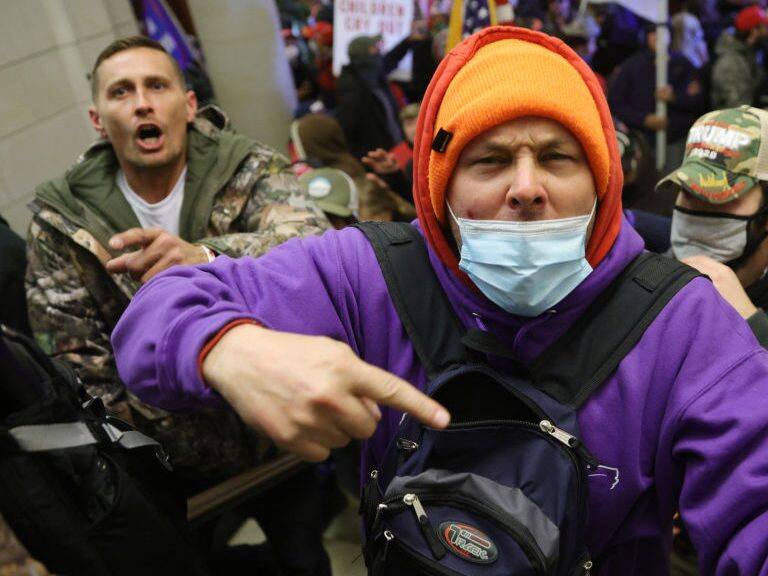 WASHINGTON, DC - JANUARY 06: Protesters enter the U.S. Capitol Building on January 06, 2021 in Washington, DC. Congress held a joint session today to ratify President-elect Joe Biden's 306-232 Electoral College win over President Donald Trump. A group of Republican senators said they would reject the Electoral College votes of several states unless Congress appointed a commission to audit the election results. (Photo by Win McNamee/Getty Images)