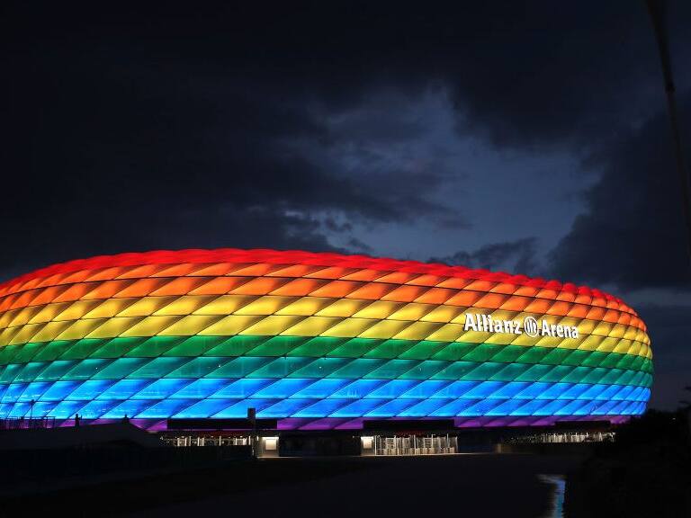 MUNICH, GERMANY - JULY 11: A general view outside of the soccer stadium Allianz Arena which is illuminated in rainbow colours for Christopher Street Day (CSD) on July 11, 2020 in Munich, Germany. Christopher Street Day is an annual European LGBT celebration and demonstration held in various cities across Europe for the rights of LGBT people and against discrimination and exclusion. (Photo by Alexander Hassenstein/Getty Images)