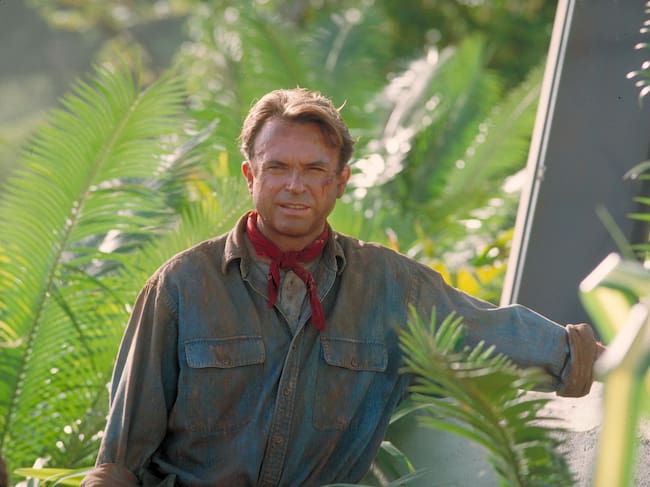 Actor Sam Neill as Dr. Alan Grant, standing next to an electric fence in a scene from the film 'Jurassic Park', 1993. (Photo by Murray Close/Getty Images)