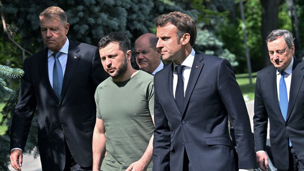 (L-R) Romanian President Romanian President Klaus Iohannis, Ukrainian President Volodymyr Zelensky, Chancellor of Germany Olaf Scholz, President of France Emmanuel Macron and Prime minister of Italy Mario Draghi walk to a press-conference following their meeting in Mariinsky Palace, in Kyiv, on June 16, 2022. - The European Union's most powerful leaders on June 16 embraced Ukraine's bid to be accepted as a candidate for EU membership, in a powerful symbol of support in Kyiv's battle against Russia's invasion. (Photo by Sergei SUPINSKY / AFP) (Photo by SERGEI SUPINSKY/AFP via Getty Images)