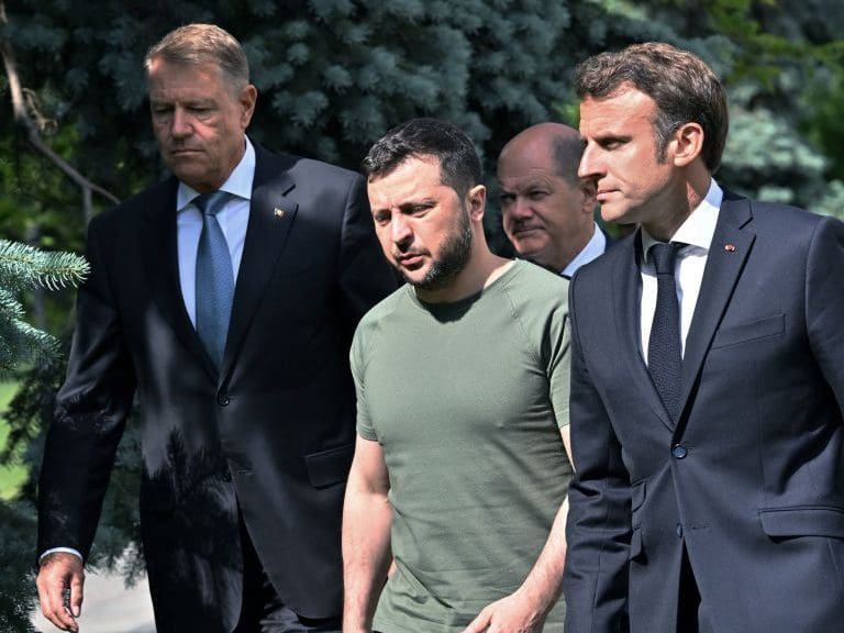 (L-R) Romanian President Romanian President Klaus Iohannis, Ukrainian President Volodymyr Zelensky, Chancellor of Germany Olaf Scholz, President of France Emmanuel Macron and Prime minister of Italy Mario Draghi walk to a press-conference following their meeting in Mariinsky Palace, in Kyiv, on June 16, 2022. - The European Union's most powerful leaders on June 16 embraced Ukraine's bid to be accepted as a candidate for EU membership, in a powerful symbol of support in Kyiv's battle against Russia's invasion. (Photo by Sergei SUPINSKY / AFP) (Photo by SERGEI SUPINSKY/AFP via Getty Images)