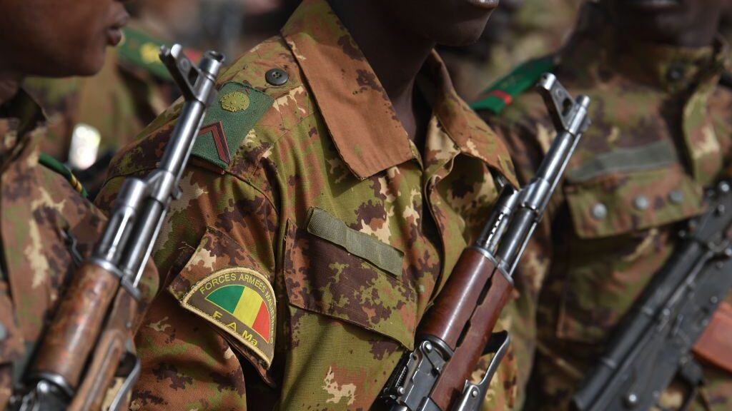 Malian troops stand guard prior to the visit of the French Prime Minister at the Operation Barkane military French base in Gao, Mali, on February 24, 2019. (Photo by ALAIN JOCARD / AFP) (Photo credit should read ALAIN JOCARD/AFP via Getty Images)