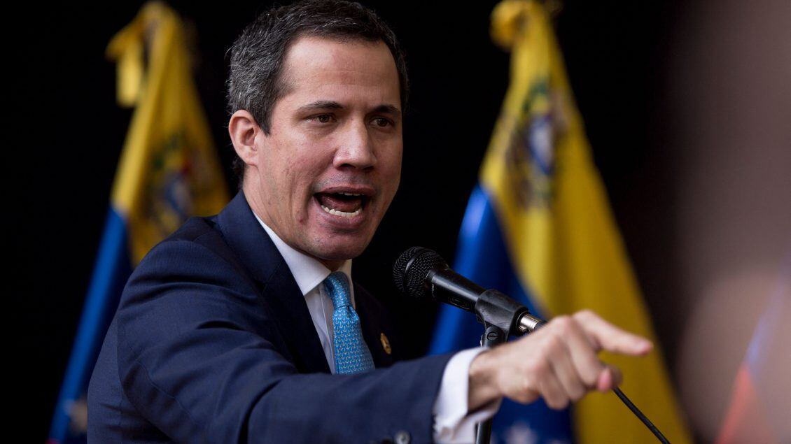 TOPSHOT - Venezuelan opposition leader Juan Guaido delivers a speech during the installation of the National Parliament for the legislative period 2022-2023, which he presides, in Caracas, on January 5, 2022. - Opposition leader Juan Guaido was ratified on Monday January 3 by the fractured opposition as "in charge of the presidency" of Venezuela, a figure that the leader adopted in 2019 with international support to try to displace from power, unsuccessfully, the socialist President Nicolas Maduro. (Photo by Pedro Rances Mattey / AFP) (Photo by PEDRO RANCES MATTEY/AFP via Getty Images)