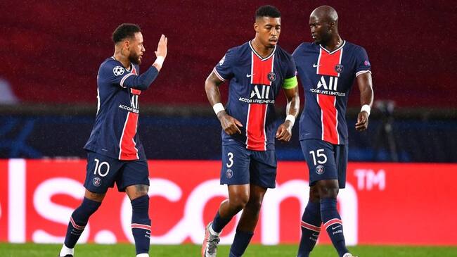 Paris Saint-Germain's Brazilian forward Neymar (L) celebrates with Paris Saint-Germain's Portuguese midfielder Danilo (R) and Paris Saint-Germain's French defender Presnel Kimpembe (C) after Manchester scored an own goal during the UEFA Champions League Group H first-leg football match between Paris Saint-Germain (PSG) and Manchester United at the Parc des Princes stadium in Paris on October 20, 2020. (Photo by FRANCK FIFE / AFP) (Photo by FRANCK FIFE/AFP via Getty Images)