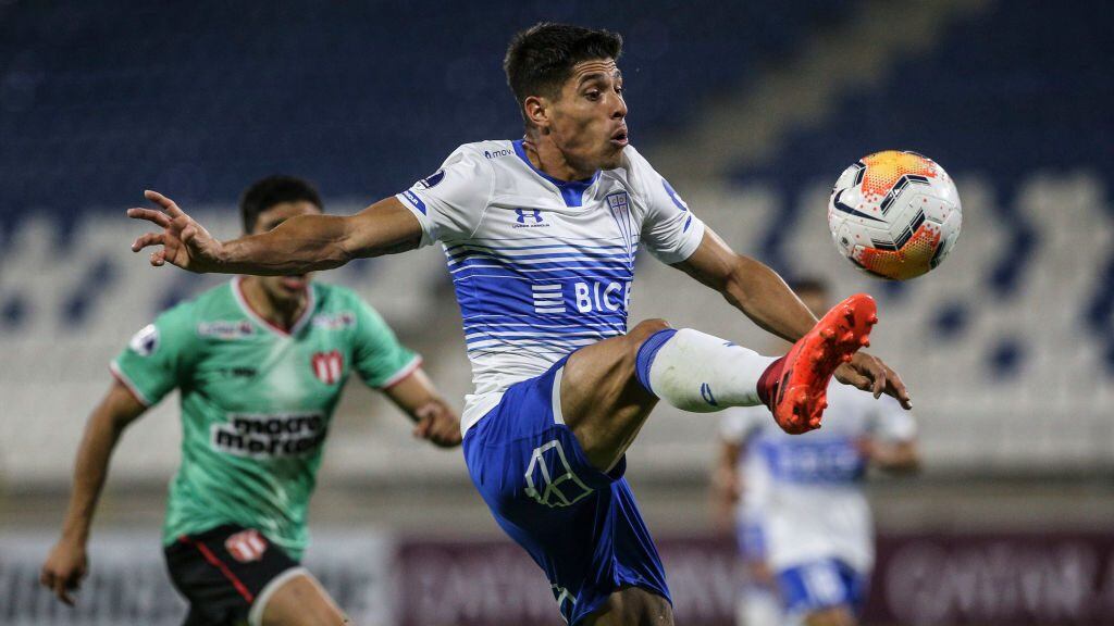 Chile's Universidad Catolica Argentine Gaston Lezcano stretches for the ball during the closed-door Copa Sudamericana round before the quarterfinals football match against Uruguay's River Plate at the San Carlos de Apoquindo stadium in Santiago, on December 3, 2020. (Photo by CLAUDIO REYES / POOL / AFP) (Photo by CLAUDIO REYES/POOL/AFP via Getty Images)