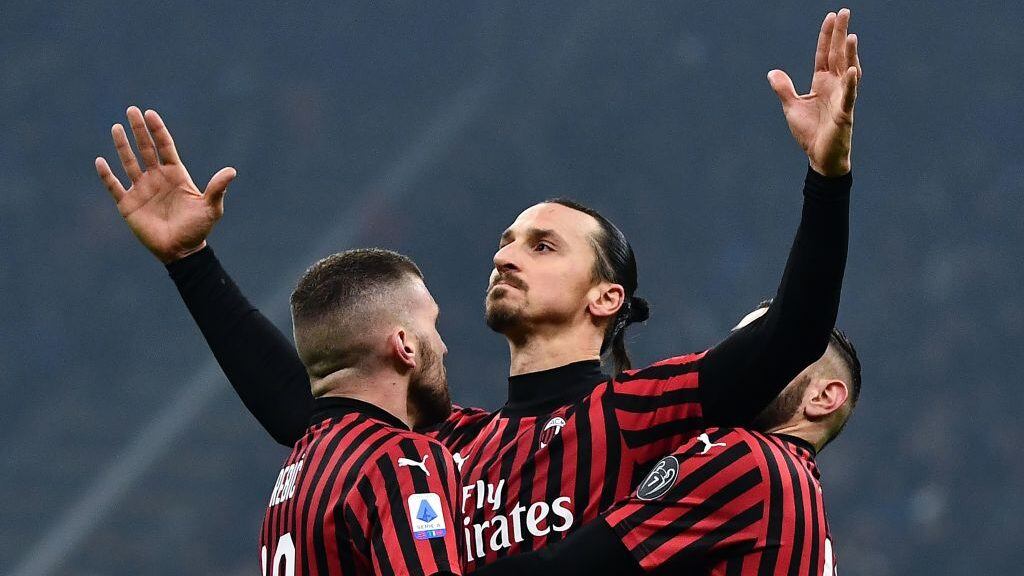 TOPSHOT - AC Milan's forward Zlatan Ibrahimovic from Sweden (C) celebrates with his teammates after scoring a goal during the Italian Serie A football match Inter Milan vs AC Milan on February 9, 2020 at the San Siro stadium in Milan. (Photo by MARCO BERTORELLO / AFP) (Photo by MARCO BERTORELLO/AFP via Getty Images)