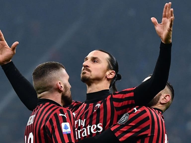 TOPSHOT - AC Milan's forward Zlatan Ibrahimovic from Sweden (C) celebrates with his teammates after scoring a goal during the Italian Serie A football match Inter Milan vs AC Milan on February 9, 2020 at the San Siro stadium in Milan. (Photo by MARCO BERTORELLO / AFP) (Photo by MARCO BERTORELLO/AFP via Getty Images)