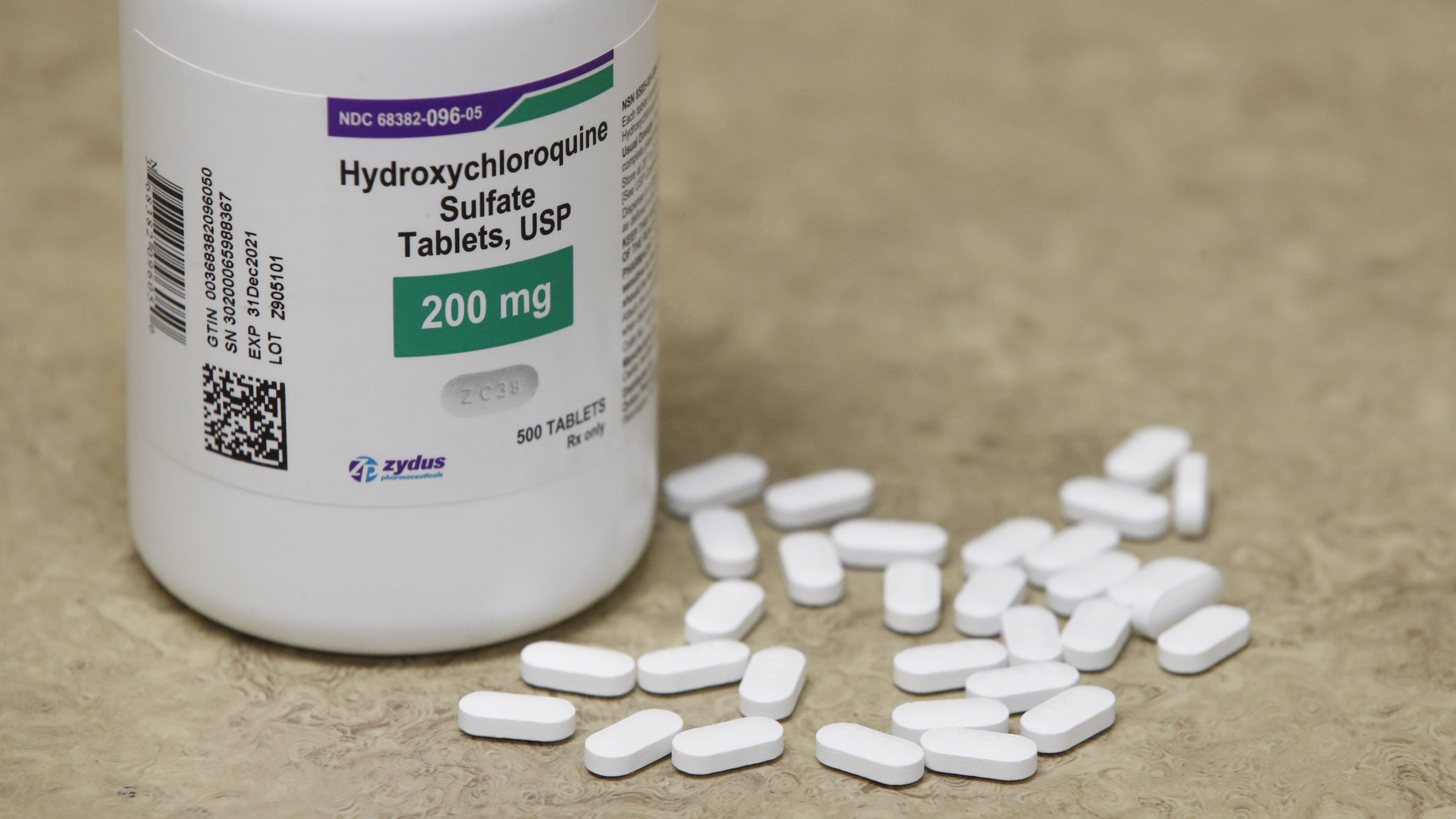 A bottle and pills of Hydroxychloroquine sit on a counter at Rock Canyon Pharmacy in Provo, Utah, on May 20, 2020. - US President Donald Trump announced May 18 he has been taking hydroxychloroquine for almost two weeks as a preventative measure against COVID-19. (Photo by GEORGE FREY / AFP) (Photo by GEORGE FREY/AFP via Getty Images)