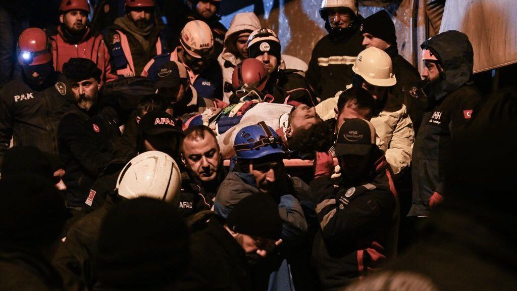 DIYARBAKIR, TURKIYE - FEBRUARY 06: 2 citizens are rescued by teams from the wreckage during the search and rescue efforts that continued in the 8-storey apartment destroyed in the earthquake, in Diyarbakir, Turkiye following 7.7 and 7.6 magnitude earthquakes hit Turkiye's Kahramanmaras on February 06, 2023. Early Monday morning, a strong 7.7 earthquake, centered in the Pazarcik district, jolted Kahramanmaras and strongly shook several provinces, including Gaziantep, Sanliurfa, Diyarbakir, Adana, Adiyaman, Malatya, Osmaniye, Hatay, and Kilis. Later, at 13.24 p.m. (1024GMT), a 7.6 magnitude quake centered in Kahramanmaras' Elbistan district struck the region. Turkiye declared 7 days of national mourning after deadly earthquakes in southern provinces. (Photo by Esra Hacioglu Karakaya/Anadolu Agency via Getty Images)