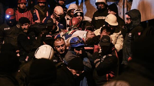 DIYARBAKIR, TURKIYE - FEBRUARY 06: 2 citizens are rescued by teams from the wreckage during the search and rescue efforts that continued in the 8-storey apartment destroyed in the earthquake, in Diyarbakir, Turkiye following 7.7 and 7.6 magnitude earthquakes hit Turkiye's Kahramanmaras on February 06, 2023. Early Monday morning, a strong 7.7 earthquake, centered in the Pazarcik district, jolted Kahramanmaras and strongly shook several provinces, including Gaziantep, Sanliurfa, Diyarbakir, Adana, Adiyaman, Malatya, Osmaniye, Hatay, and Kilis. Later, at 13.24 p.m. (1024GMT), a 7.6 magnitude quake centered in Kahramanmaras' Elbistan district struck the region. Turkiye declared 7 days of national mourning after deadly earthquakes in southern provinces. (Photo by Esra Hacioglu Karakaya/Anadolu Agency via Getty Images)