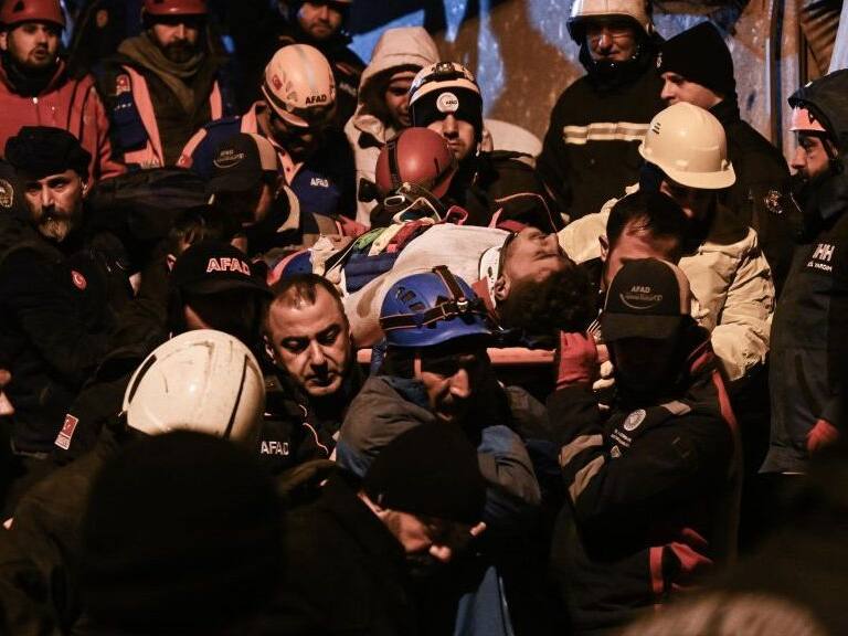 DIYARBAKIR, TURKIYE - FEBRUARY 06: 2 citizens are rescued by teams from the wreckage during the search and rescue efforts that continued in the 8-storey apartment destroyed in the earthquake, in Diyarbakir, Turkiye following 7.7 and 7.6 magnitude earthquakes hit Turkiye's Kahramanmaras on February 06, 2023. Early Monday morning, a strong 7.7 earthquake, centered in the Pazarcik district, jolted Kahramanmaras and strongly shook several provinces, including Gaziantep, Sanliurfa, Diyarbakir, Adana, Adiyaman, Malatya, Osmaniye, Hatay, and Kilis. Later, at 13.24 p.m. (1024GMT), a 7.6 magnitude quake centered in Kahramanmaras' Elbistan district struck the region. Turkiye declared 7 days of national mourning after deadly earthquakes in southern provinces. (Photo by Esra Hacioglu Karakaya/Anadolu Agency via Getty Images)