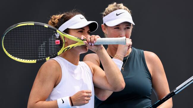 MELBOURNE, AUSTRALIA - FEBRUARY 01: Alex Guarachi of Chile and Desirae Krawczyk of the United States talk tactics in their doubles match against Anna Kalinskaya of Russia and Viktoria Kuzmova of Slovakia during day two of the WTA 500 Yarra Valley Classic at Melbourne Park on February 01, 2021 in Melbourne, Australia. (Photo by Jonathan DiMaggio/Getty Images)