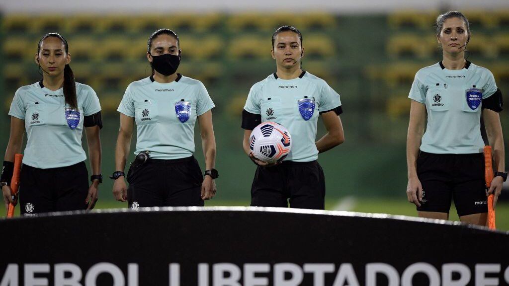 Brazilian referee Edina Alves (2nd R) next to assistants Brazilian Neuza Back (R), Chilean Cindy Nahuelcoy (L) and Chilean Maria Belen Carvajal wait for the start of the Copa Libertadores football tournament group stage match between Argentina's Defensa y Justicia and Ecuador's Independiente del Valle, at the Norberto Tito Tomaghello stadium in Florencio Varela, Buenos Aires province, on May 27, 2021. (Photo by JUAN MABROMATA / AFP) (Photo by JUAN MABROMATA/AFP via Getty Images)