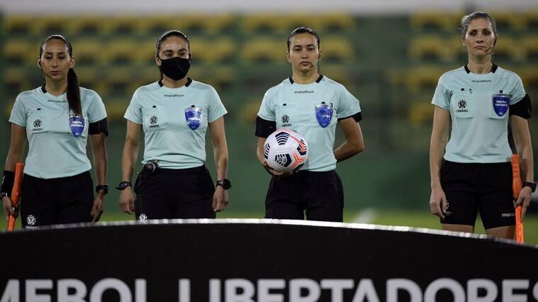 Brazilian referee Edina Alves (2nd R) next to assistants Brazilian Neuza Back (R), Chilean Cindy Nahuelcoy (L) and Chilean Maria Belen Carvajal wait for the start of the Copa Libertadores football tournament group stage match between Argentina's Defensa y Justicia and Ecuador's Independiente del Valle, at the Norberto Tito Tomaghello stadium in Florencio Varela, Buenos Aires province, on May 27, 2021. (Photo by JUAN MABROMATA / AFP) (Photo by JUAN MABROMATA/AFP via Getty Images)