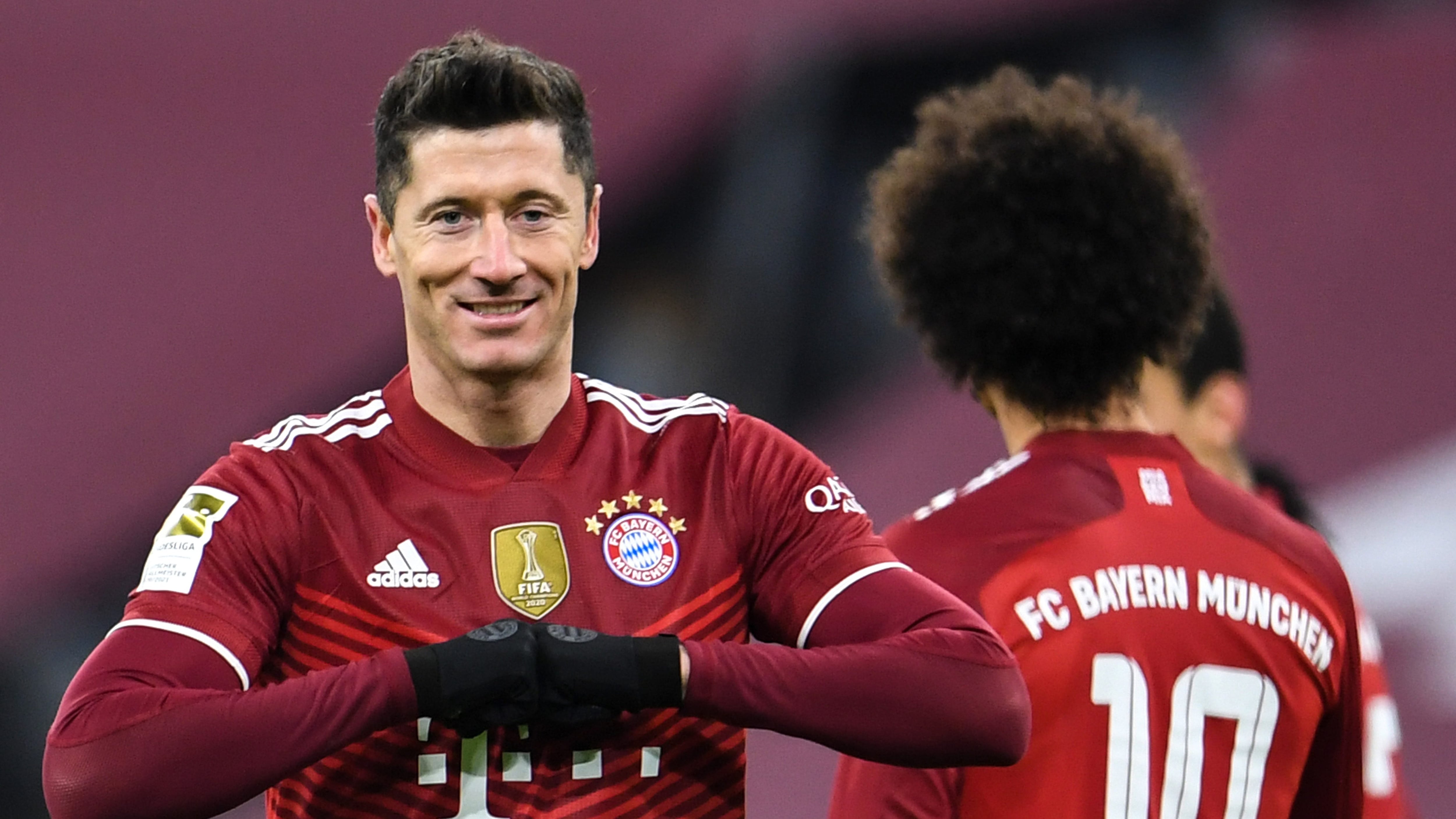 17 December 2021, Bavaria, Munich: Football: Bundesliga, Bayern Munich - VfL Wolfsburg, Matchday 17, at Allianz Arena. Munich's Robert Lewandowski celebrates his goal to make it 4:0. (RECROP) IMPORTANT NOTE: In accordance with the regulations of the DFL Deutsche Fußball Liga and the DFB Deutscher Fußball-Bund, it is prohibited to use or have used photographs taken in the stadium and/or of the match in the form of sequence pictures and/or video-like photo series. Photo: Tobias Hase/dpa (Photo by Tobias Hase/picture alliance via Getty Images)