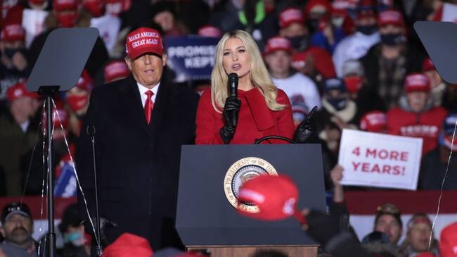 KENOSHA, WISCONSIN - NOVEMBER 02: President Donald Trump listens as his daughter Ivanka Trump speaks during a campaign rally at the Kenosha Regional Airport on November 02, 2020 in Kenosha, Wisconsin. Trump, who won Wisconsin with less than 1 percent of the vote in 2016, currently trails former vice president and Democratic presidential candidate Joe Biden in the state according to recent polls. (Photo by Scott Olson/Getty Images)