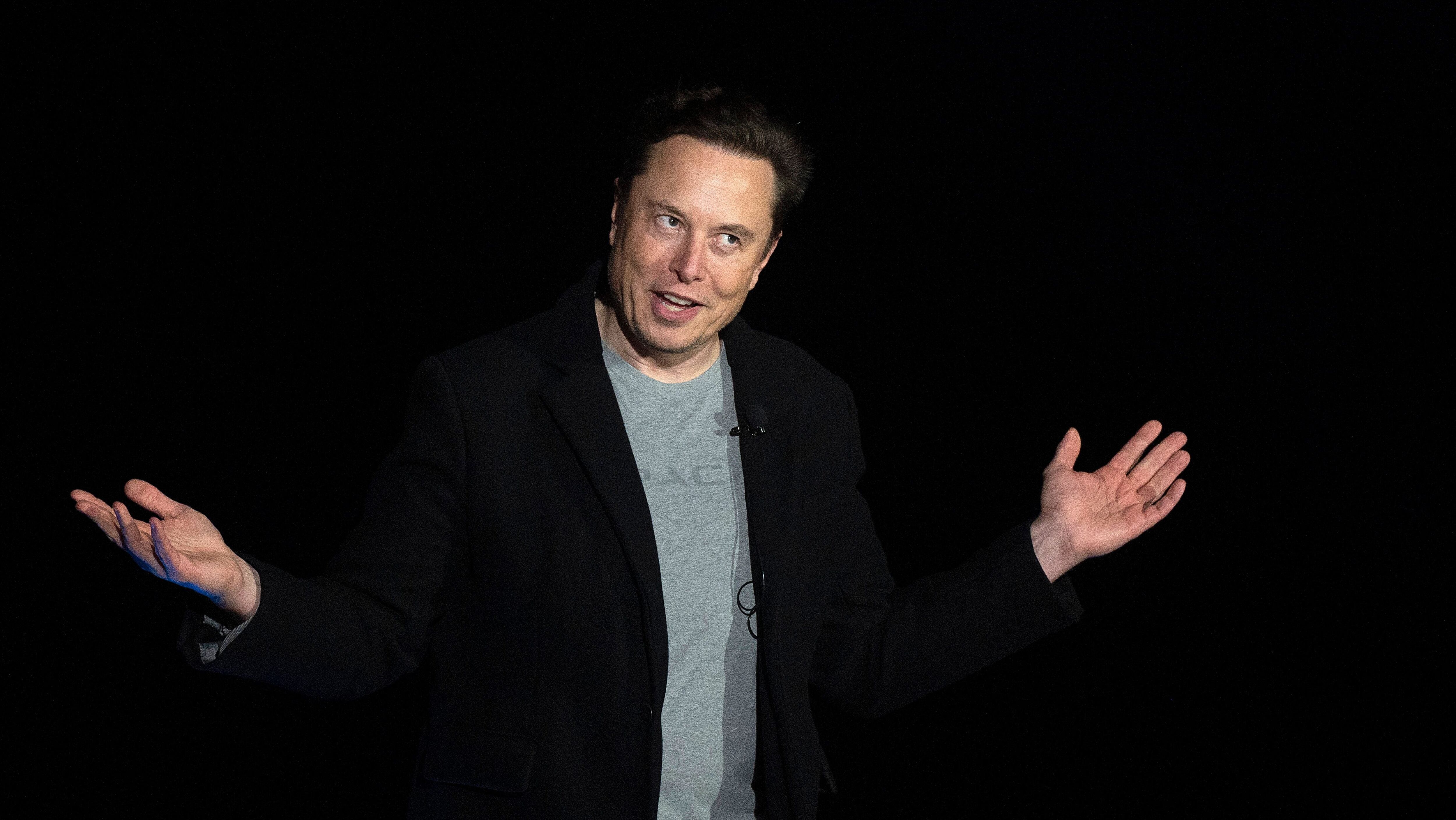 Elon Musk gestures as he speaks during a press conference at SpaceX's Starbase facility near Boca Chica Village in South Texas on February 10, 2022. - Billionaire entrepreneur Elon Musk delivered an eagerly-awaited update on SpaceX's Starship, a prototype rocket the company is developing for crewed interplanetary exploration. (Photo by JIM WATSON / AFP) (Photo by JIM WATSON/AFP via Getty Images)