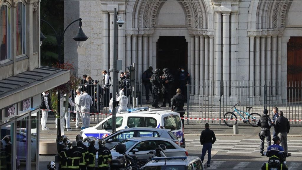 French members of the elite tactical police unit RAID enter to search the Basilica of Notre-Dame de Nice after a knife attack in Nice on October 29, 2020. - A man wielding a knife outside a church in the southern French city of Nice slit the throat of one person, leaving another dead and injured several others in an attack on Thursday morning, officials said. The suspected assailant was detained shortly afterwards, a police source said, while interior minister Gerald Darmanin said on Twitter that he had called a crisis meeting after the attack. (Photo by Valery HACHE / AFP) (Photo by VALERY HACHE/AFP via Getty Images)