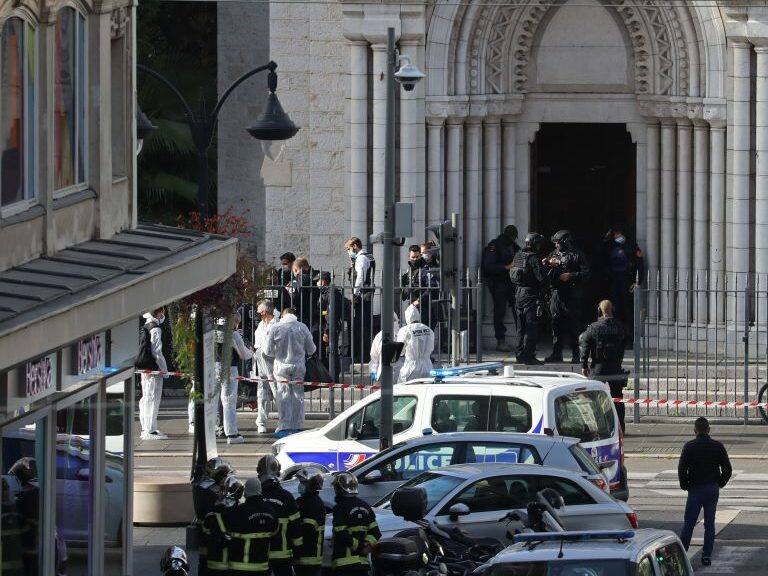 French members of the elite tactical police unit RAID enter to search the Basilica of Notre-Dame de Nice after a knife attack in Nice on October 29, 2020. - A man wielding a knife outside a church in the southern French city of Nice slit the throat of one person, leaving another dead and injured several others in an attack on Thursday morning, officials said. The suspected assailant was detained shortly afterwards, a police source said, while interior minister Gerald Darmanin said on Twitter that he had called a crisis meeting after the attack. (Photo by Valery HACHE / AFP) (Photo by VALERY HACHE/AFP via Getty Images)