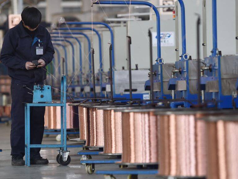 NANJING, CHINA - JANUARY 18: An employee produces copper wires at Nanjing Gree Electric Enterprise Co., Ltd. on January 18, 2021 in Nanjing, Jiangsu Province of China. (Photo by Fang Dongxu/VCG via Getty Images)