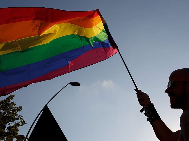 BARCELONA, SPAIN - JUNE 27:  A reveller waves a pride flag during the annual Pride Parade on June 27, 2015 in Barcelona, Spain. Gay parade marches are taking place in at different places around the world to commemorate the start of the gay rights movement.  (Photo by Pablo Blazquez Dominguez/Getty Images)