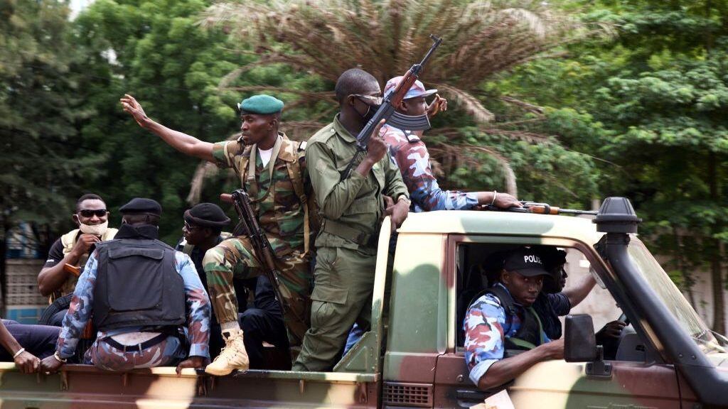 Malian soldiers drive through the streets of Bamako, Mali on August 19, 2020, the day after rebel troops seized Malian President Ibrahim Boubacar Keita and Prime Minister Boubou Cisse in a dramatic escalation of a months-long crisis. - Mali awoke on August 19, 2020, to a new chapter in its troubled history after rebel military leaders forced Malian President Boubacar Keita from office, prompting its West African neighbours to threaten border closures and sanctions against the coup leaders.Keita, embattled by months of protests over economic stagnation, corruption and a brutal Islamist insurgency, said he had resigned to avoid bloodshed. (Photo by ANNIE RISEMBERG / AFP) (Photo by ANNIE RISEMBERG/AFP via Getty Images)