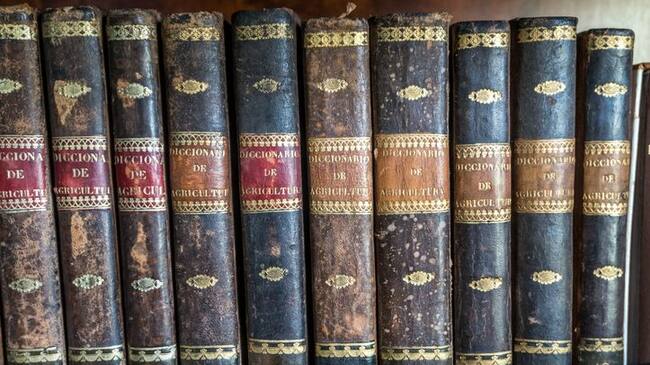 Close-up of leather-bound vintage agriculture encyclopaedia, Oleiros, A Coruna, Galicia, Spain