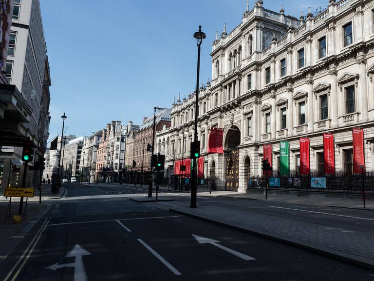 LONDON, UNITED KINGDOM - APRIL 07, 2020: A view of almost deserted Piccadilly and the Royal Academy of Arts in central London as the UK&#039;s nationwide lockdown continues with the aim to slow down the spread of the Coronavirus disease on 07 April, 2020 in London, England. According to data published yesterday by the Department of Health and Social Care, the total number of people who tested positive for Covid-19 in the UK increased to 51,608 while the hospital death toll rose to 5,373.- PHOTOGRAPH BY Wiktor Szymanowicz / Barcroft Studios / Future Publishing (Photo credit should read Wiktor Szymanowicz/Barcroft Media via Getty Images)