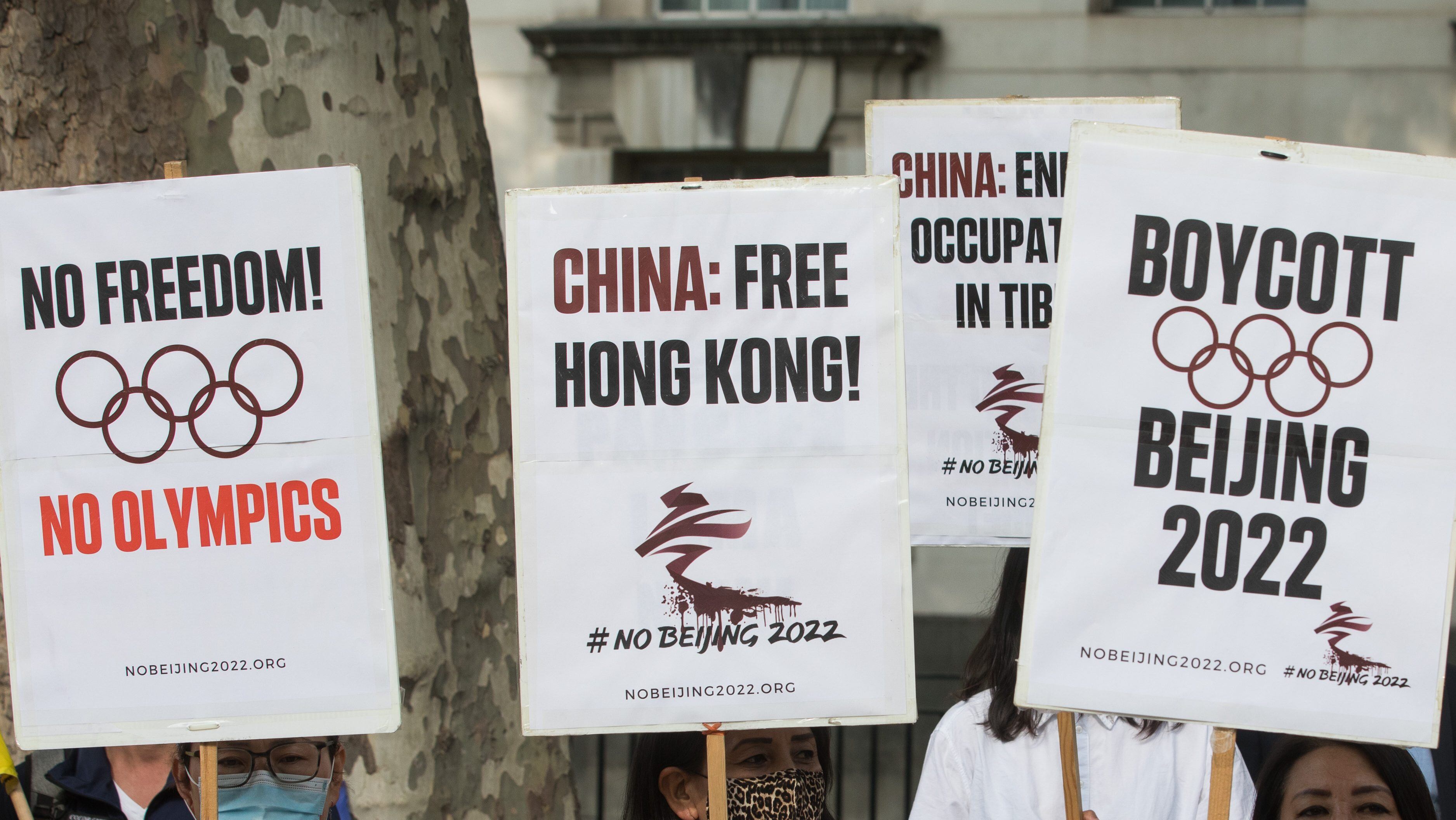 Free Tibet campaigners and members of the Hong Kong, Tibetan and Uyghur communities hold a rally opposite Downing Street as part of a global day of action in protest against the Beijing 2022 Winter Games on 23rd June 2021 in London, United Kingdom. Speakers condemned the International Olympic Committee (IOC) for its insistence that the Beijing 2022 Winter Games should go ahead in spite of the Chinese government's human rights violations against the Uyghur people and in Tibet, Hong Kong and Southern Mongolia and called on the UK government and British Olympic Association to boycott the games. (photo by Mark Kerrison/In Pictures via Getty Images)