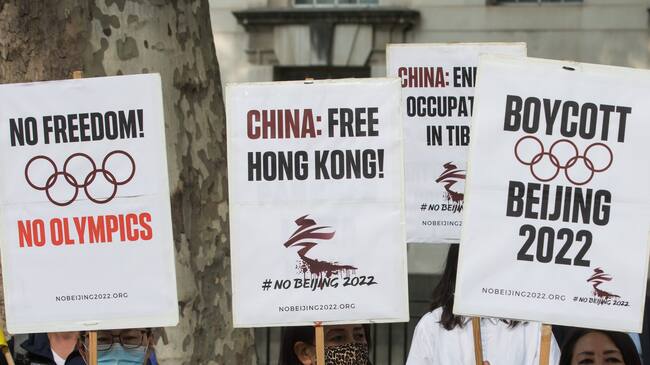 Free Tibet campaigners and members of the Hong Kong, Tibetan and Uyghur communities hold a rally opposite Downing Street as part of a global day of action in protest against the Beijing 2022 Winter Games on 23rd June 2021 in London, United Kingdom. Speakers condemned the International Olympic Committee (IOC) for its insistence that the Beijing 2022 Winter Games should go ahead in spite of the Chinese government's human rights violations against the Uyghur people and in Tibet, Hong Kong and Southern Mongolia and called on the UK government and British Olympic Association to boycott the games. (photo by Mark Kerrison/In Pictures via Getty Images)