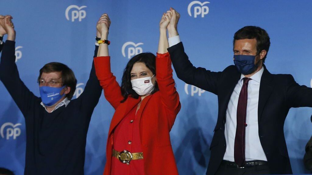MADRID, SPAIN - MAY 04: The president of the Community of Madrid and Spanish Peoples' Party candidate for re-election, Isabel Diaz Ayuso (C), Pablo Casado, the leader of Spainâs Popular Party (R) and Madrid Mayor Jose Luis Martinez Almeida (L) attend the celebrations for election results after the Madrid regional elections which started 9 am. in local time, in Madrid, Spain on May 4, 2021. Spain elected the new members of the Assembly of Madrid after regional President Isabel Diaz Ayuso called an early election. Over 5 million people vote for the regional legislature. (Photo by Senhan Bolelli/Anadolu Agency via Getty Images)