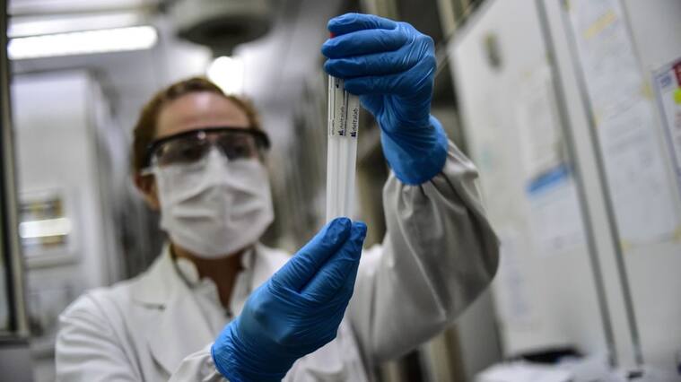 BUENOS AIRES, ARGENTINA - APRIL 28: Biochemist Daniela Beatriz Ori manipulates swab samples to make a real time polymerase chain reaction (RT-PCR) analysis for COVID-19 testing at the biochemistry lab of Central Navy Hospital Dr. Pedro Malloon April 28, 2020 in Buenos Aires, Argentina. The hospital, which is treating COVID-19 patients, has capacity to process up to 36 swab samples a day. (Photo by Amilcar Orfali/Getty Images)