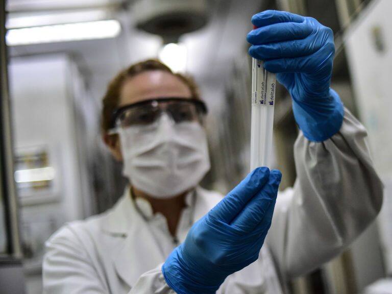 BUENOS AIRES, ARGENTINA - APRIL 28: Biochemist Daniela Beatriz Ori manipulates swab samples to make a real time polymerase chain reaction (RT-PCR) analysis for COVID-19 testing at the biochemistry lab of Central Navy Hospital Dr. Pedro Malloon April 28, 2020 in Buenos Aires, Argentina. The hospital, which is treating COVID-19 patients, has capacity to process up to 36 swab samples a day. (Photo by Amilcar Orfali/Getty Images)