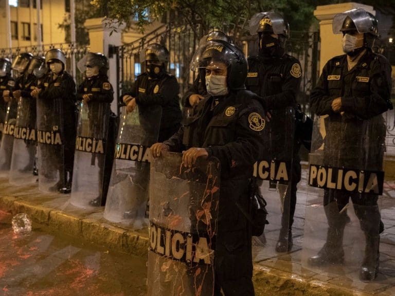 LIMA, PERU - NOVEMBER 17: Riot police officers stand guard during a protest to demand justice for the deaths of two young demonstrators who were killed during a protest on November 17, 2020 in Lima, Peru. Lawmakers chose Sagasti to become interim president until the next presidential elections scheduled for July 28th, 2021. He is the third president in a week after the Congress removed Martin Vizcarra and protests forced the resignation of interim Manuel Merino on Sunday. (Photo by Beto Baron/Getty Images)