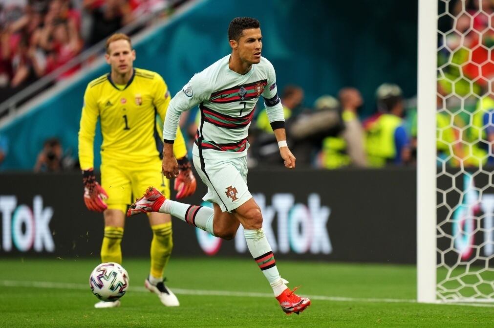 BUDAPEST, HUNGARY - JUNE 15: Cristiano Ronaldo of Portugal celebrates after scoring their side's second goal during the UEFA Euro 2020 Championship Group F match between Hungary and Portugal at Puskas Arena on June 15, 2021 in Budapest, Hungary. (Photo by Angel Martinez - UEFA/UEFA via Getty Images)