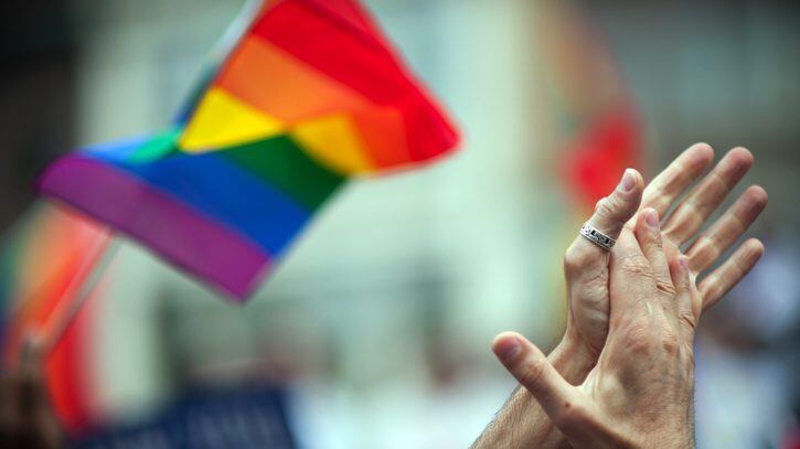 LGBT rinbow flag and clapping hands.