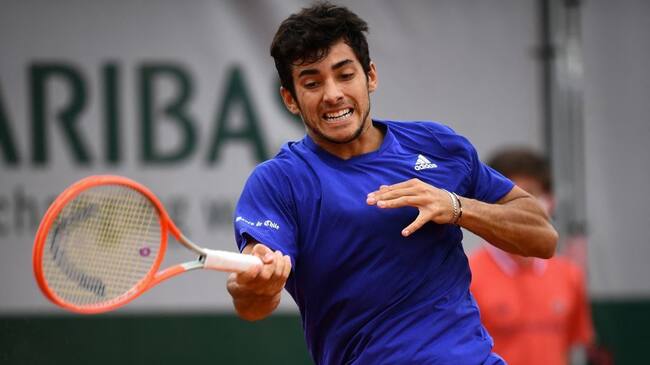 Chile's Christian Garin returns the ball to Marcos Giron of the US during their men's singles third round tennis match on Day 6 of The Roland Garros 2021 French Open tennis tournament in Paris on June 4, 2021. (Photo by Christophe ARCHAMBAULT / AFP) (Photo by CHRISTOPHE ARCHAMBAULT/AFP via Getty Images)