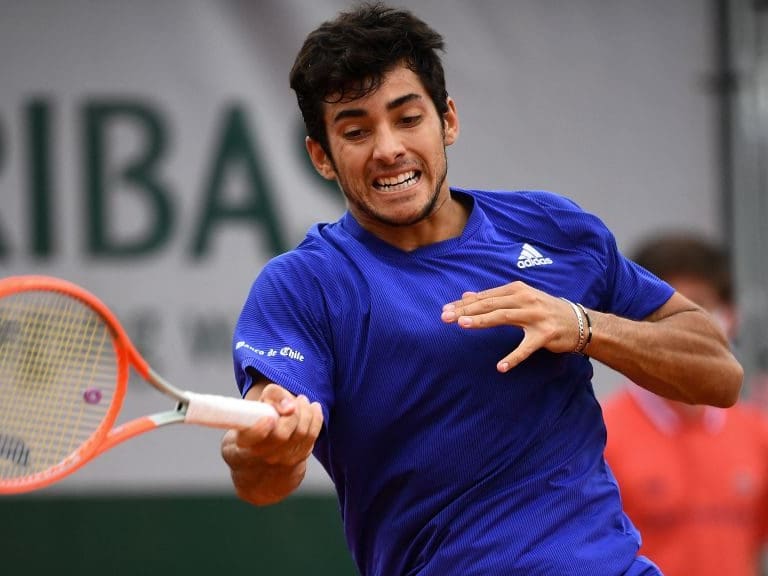 Chile's Christian Garin returns the ball to Marcos Giron of the US during their men's singles third round tennis match on Day 6 of The Roland Garros 2021 French Open tennis tournament in Paris on June 4, 2021. (Photo by Christophe ARCHAMBAULT / AFP) (Photo by CHRISTOPHE ARCHAMBAULT/AFP via Getty Images)