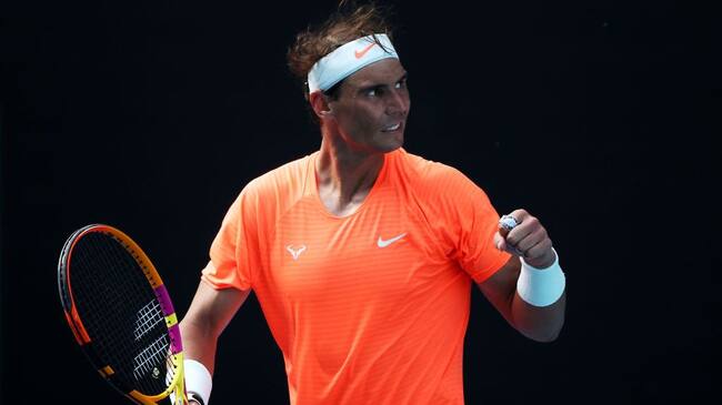 MELBOURNE, AUSTRALIA - FEBRUARY 15: Rafael Nadal of Spain celebrates winning match point in his Men's Singles fourth round match against Fabio Fognini of Italy during day eight of the 2021 Australian Open at Melbourne Park on February 15, 2021 in Melbourne, Australia. (Photo by Mark Metcalfe/Getty Images)