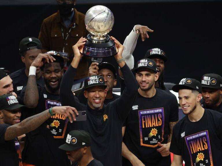 LOS ANGELES, CALIFORNIA - JUNE 30: Head coach Monty Williams of the Phoenix Suns holds the Western Conference Championship trophy after the Suns defeated the LA Clippers in Game Six of the Western Conference Finals at Staples Center on June 30, 2021 in Los Angeles, California. NOTE TO USER: User expressly acknowledges and agrees that, by downloading and or using this photograph, User is consenting to the terms and conditions of the Getty Images License Agreement. (Photo by Ronald Martinez/Getty Images)