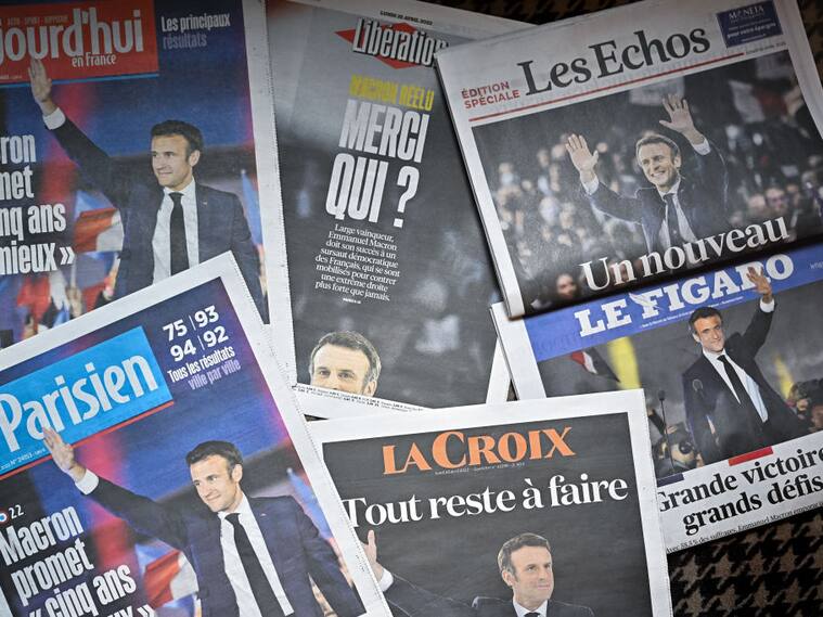 PARIS, FRANCE - APRIL 25: Front pages of the French newspapers show France's centrist incumbent president Emmanuel Macron after beating his far-right rival Marine Le Pen for a second five-year term on April 25, 2022 in Paris, France. Incumbent French president Emmanuel Macron won the 2022 presidential election on April 24, with 58.54 percent of the vote, his far-right rival Marine Le Pen won 41.46 percent of votes, according to the French Ministry of the Interior. Around 14 million voters in France refused to chose between the two finalists, one million more in abstention compared to the first round of voting on April 10 (12.8 million). (Photo by Jeff J Mitchell/Getty Images)