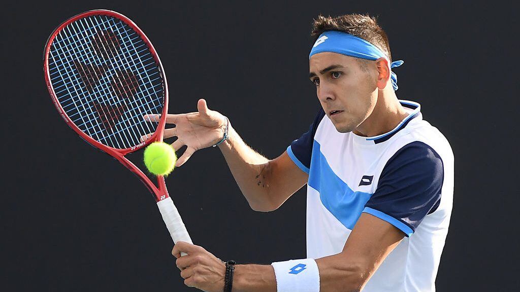 MELBOURNE, AUSTRALIA - JANUARY 23: Alejandro Tabilo of Chile plays a backhand during his Men's Singles second round match against John Isner of the United States on day four of the 2020 Australian Open at Melbourne Park on January 23, 2020 in Melbourne, Australia. (Photo by Jaimi Chisholm/Getty Images)