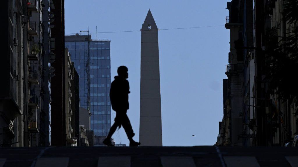 A homeless man crosses Corrientes Avenue in Buenos Aires' downtown, on April 8, 2020 during the "preventative and compulsory" lockdown of the population due to the pandemic of the new coronavirus, COVID-19. - More than 1.46 million cases have been officially recorded and at least 86,289 have died in 192 countries since the virus emerged in China in December, according to an AFP tally at 1900 GMT Wednesday based on official sources. (Photo by Juan MABROMATA / AFP) (Photo by JUAN MABROMATA/AFP via Getty Images)