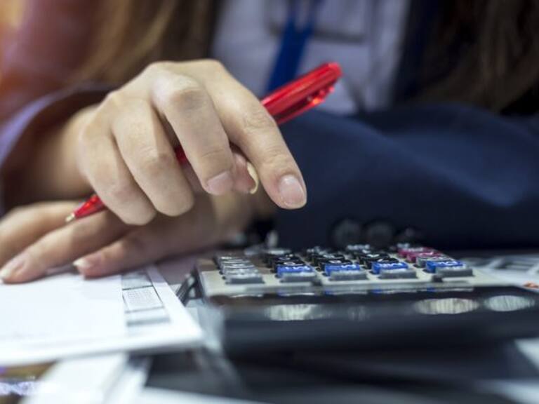 Hands of bank officer calculating loans